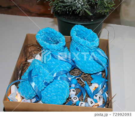 Blue booties for the newborn in the gift package. Translation: Bohdan Blue booties for the newborn in the gift package. Translation: Bohdan 72992093