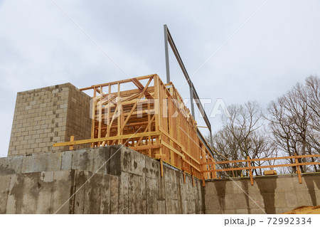 Wooden house frame structure on a new development 72992334