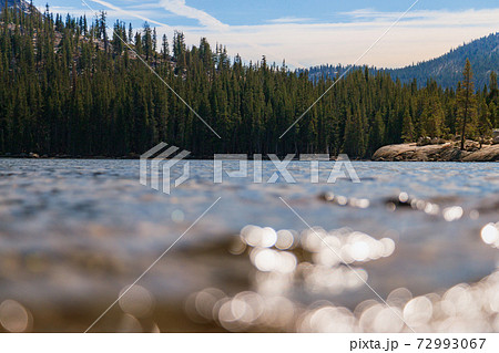 A sunlit shot of from the surface of Lake Tenaya in Yosemite National Park 72993067