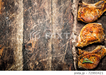 Grilled pork steak with spices. 72993421