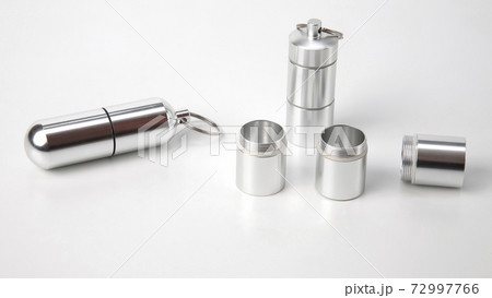 sealed aluminum containers for small items and medical pills on a white background 72997766