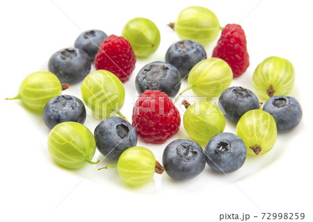 Assorted fresh different berries on a white plate. Assorted fresh different berries on a white plate. 72998259