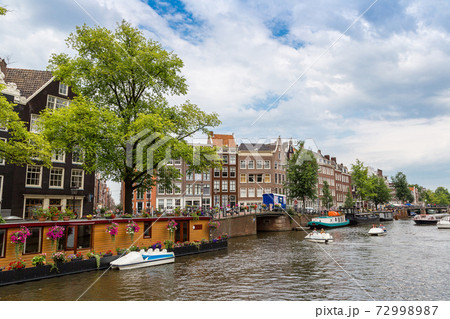 Amsterdam canals and boats, Holland, Netherlands. Amsterdam canals and boats, Holland, Netherlands. 72998987