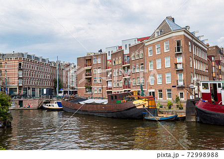 Amsterdam canals and boats, Holland, Netherlands. Amsterdam canals and boats, Holland, Netherlands. 72998988