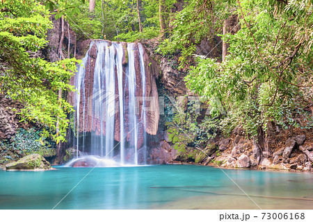 Waterfall and emerald lake in tropical forest, Erawan, Thailand 73006168