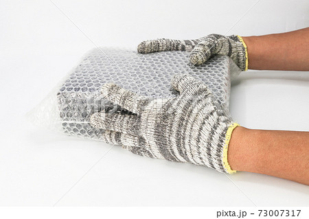 hand of man hold bubble wrap, for protection parcel product cracked or insurance During transit 73007317