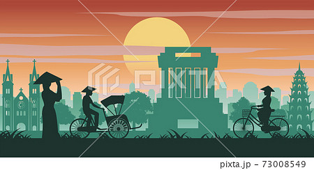 Vietnamese woman and man ride bicycle pass landmark of Vietnam,vintage color with sunset time tone 73008549