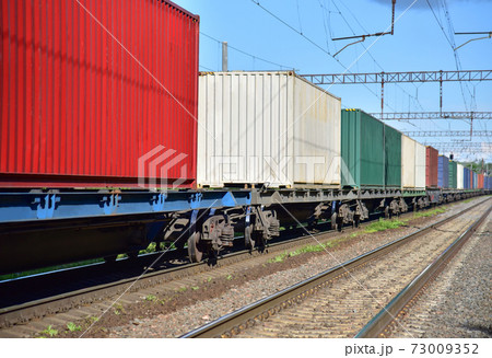 Cargo Containers Transportation On Freight Train By Railway. Intermodal Container On Train Car.  73009352