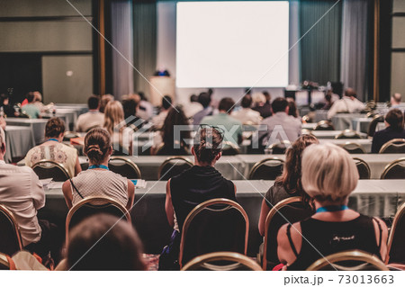 Audience in lecture hall participating at business conference. Audience in lecture hall participating at business conference. 73013663