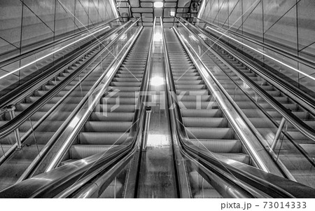 Upward view of a Silver Escalator with leading lines Upward view of a Silver Escalator with leading lines 73014333