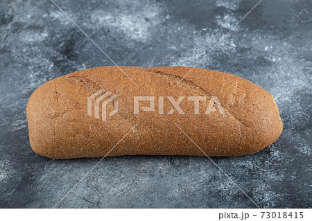 Loaf of bread isolated on white background. Whole bread. Horizontal frame. Studio Loaf of bread isolated on white background. Whole bread. Horizontal frame. Studio 73018415