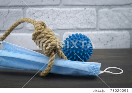 Noose around a face mask and virus molecule 73020091