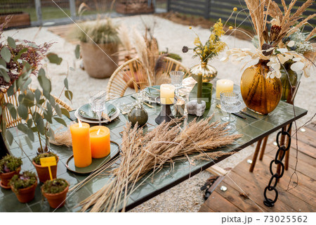 Festively decorated dinning table in green tones 73025562
