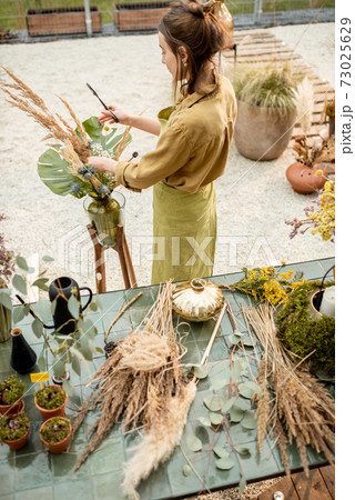 Woman making floral compositions Woman making floral compositions 73025629