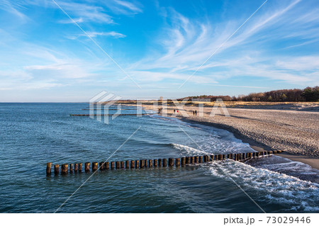 Groynes on shore of the Baltic sea in Graal-Mueritz, Germany 73029446