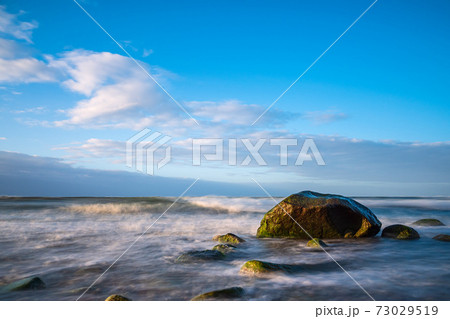 Stones on shore of the Baltic Sea near Warnemuende, Germany Stones on shore of the Baltic Sea near Warnemuende, Germany 73029519