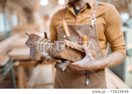 Carpenter with working tools Carpenter with working tools 73029646