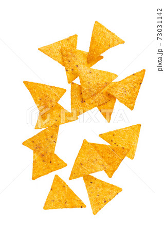 corn nachos chips or falling isolated on white background with clipping path. corn nachos chips or falling isolated on white background with clipping path. 73031142
