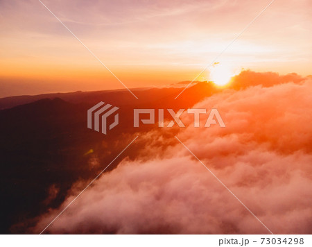 Aerial view with over clouds with sunrise 73034298