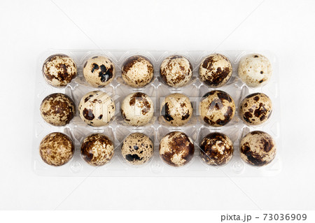 Quail egg pack on a white background. Healthy, breakfast and poultry concept 73036909