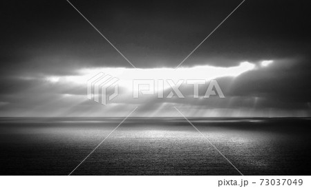 Dramatic Sky over the ocean in black and white Dramatic Sky over the ocean in black and white 73037049