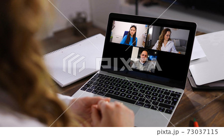 Young business woman at home office attends a video conference 73037115