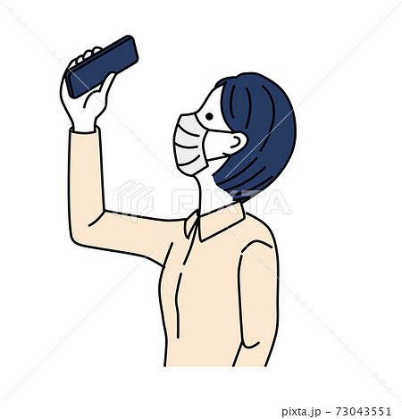 Woman in mask taking pictures with smartphone 73043551
