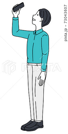 A man taking a picture with a smartphone A man taking a picture with a smartphone 73043607