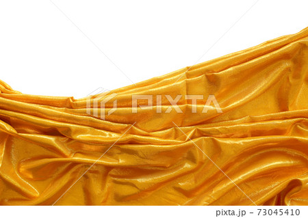 Golden fabric on white background 73045410