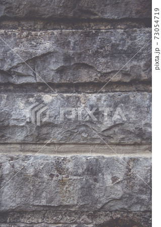 Close up of a stone wall, as a background texture Close up of a stone wall, as a background texture 73054719