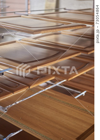 Wood doors varnished and drying in a carpentry workshop Wood doors varnished and drying in a carpentry workshop 73054864