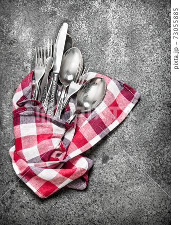 Serving background. Cutlery on a napkin. 73055885