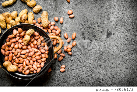Peanuts in a bowl. 73056172