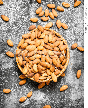 Almonds in the basket. 73056760