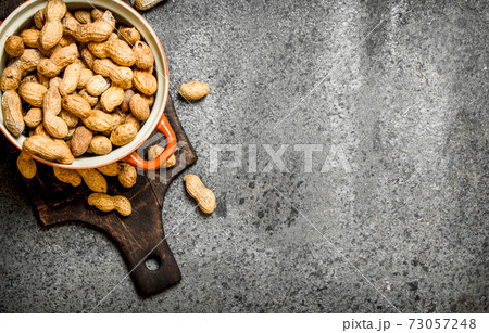 Peanuts in a bowl. 73057248