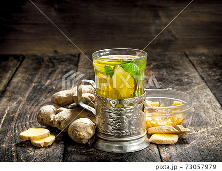 Ginger tea with mint and lemon. Ginger tea with mint and lemon. 73057979