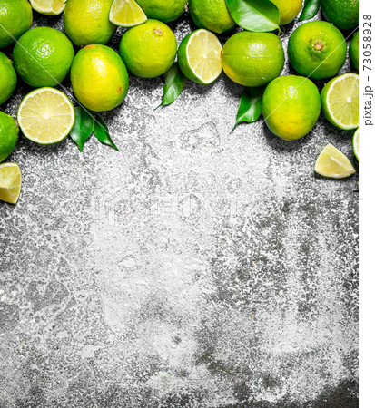 Ripe lime with green leaves. Ripe lime with green leaves. 73058928