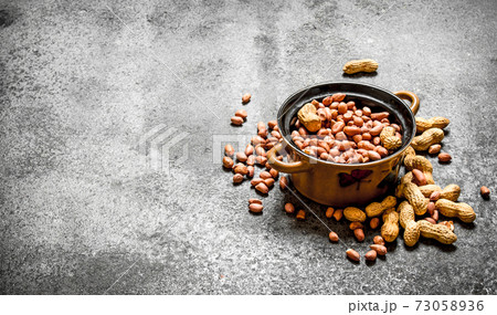 Peanuts in a bowl. 73058936