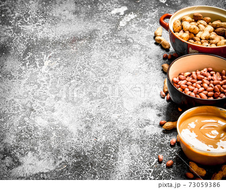Nuts and peanut butter in a bowl. Nuts and peanut butter in a bowl. 73059386