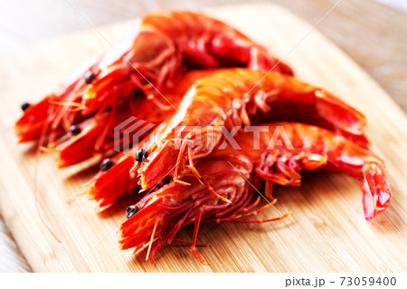 Fresh Raw Red Shrimp on Cutting Board. High quality photo Fresh Raw Red Shrimp on Cutting Board. High quality photo 73059400