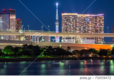 東京都 お台場ベイエリアの夜景 スカイツリーとタワーマンションの写真素材