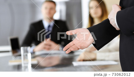 Business presentation. Unknown businessman giving a speech to colleagues or partners at corporate conference. Meeting concept 73062012