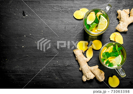 Ginger tea with mint and lemon. Ginger tea with mint and lemon. 73063398