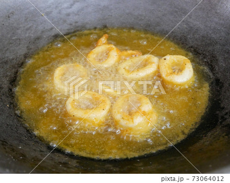 Squid cut into small pieces and fried with flour. The flour has been mixed with eggs to add flavour and to make it crisper. Squid cut into small pieces and fried with flour. The flour has been mixed with eggs to add flavour and to make it crisper. 73064012