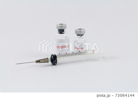 Corona virus vaccine in bottles on white background, COVID19 73064144