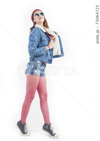 young pretty stylish brunette hipster girl posing emotional isolated on white background happy smiling cool smile, lifestyle people concept 73064725