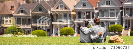 San Francisco travel tourists couple looking at houses landscape banner. First real estate buyers looking to buy a home, homeowner concept. Background of neighborhood 73066787