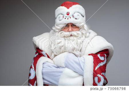Serious Santa Claus crossed his arms over his 73066798