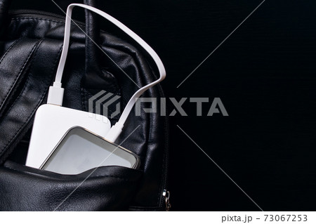 The phone and power bank in the bag The phone and power bank in the bag 73067253
