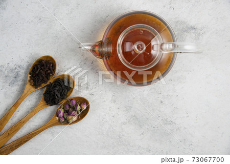 Wooden spoons with dried roses, loose teas and cloves Wooden spoons with dried roses, loose teas and cloves 73067700